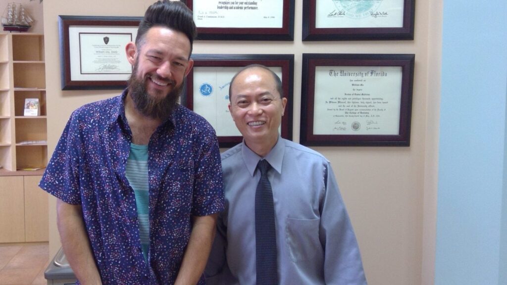Dr. William Ma smiling with a patient